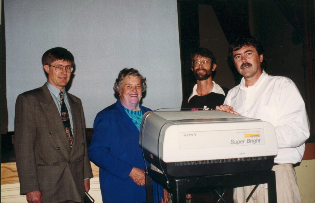 Dec 1994 The new state-of-the-art projector is officially presented by the Sony rep who gave us a discount, the woman’s auxiliary who kicked in the $5000 balance, me and the AV manager Ron Thompson who was my very helpful contact at VIHA. It was a great boost of confidence in what I was doing with MM.