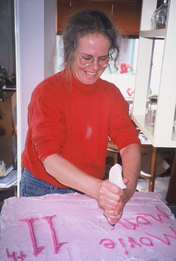 June 2016 volunteer Valda puts finishing touches on the homemade 11th anniversary cake