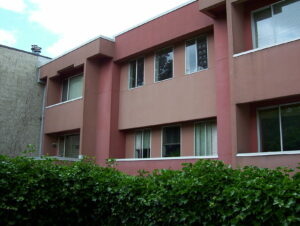 Brick -coloured two story apartment building, circa 1980s 