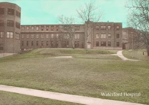 low-rise institutional building early 20th century with lawns in front