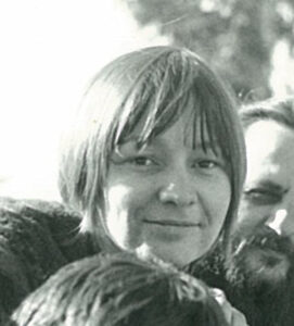 smiling young woman with bangs and short hair