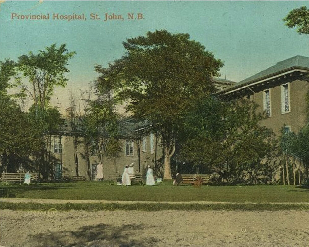 old building with woman wearing white dresses on grass
