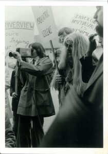 1970s protesters and media film crew